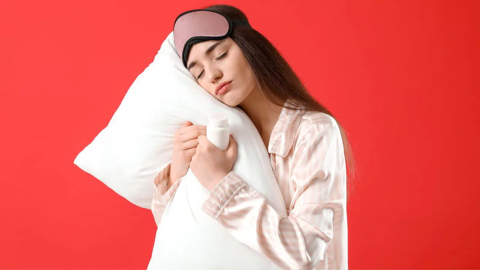 girl resting her eyes holding a pillow
