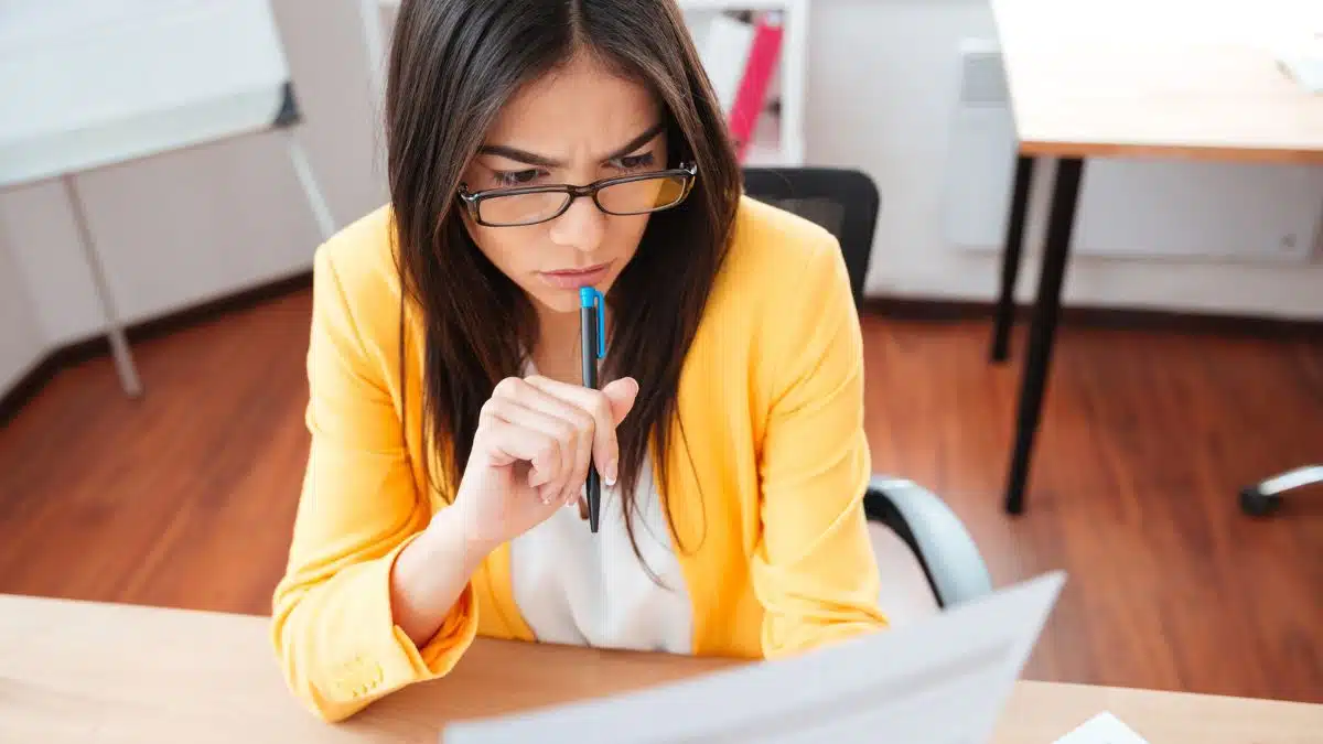 thinking woman editing proofreading work