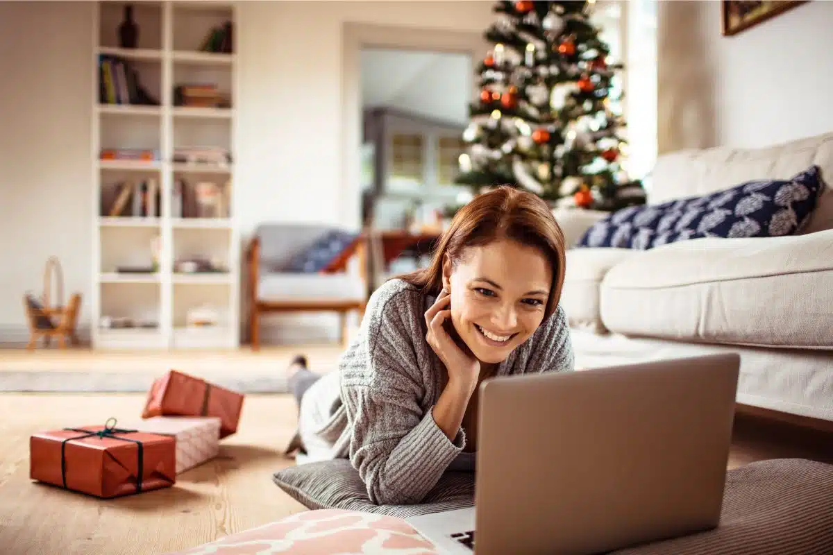a woman job searching on her laptop during the Christmas holidays