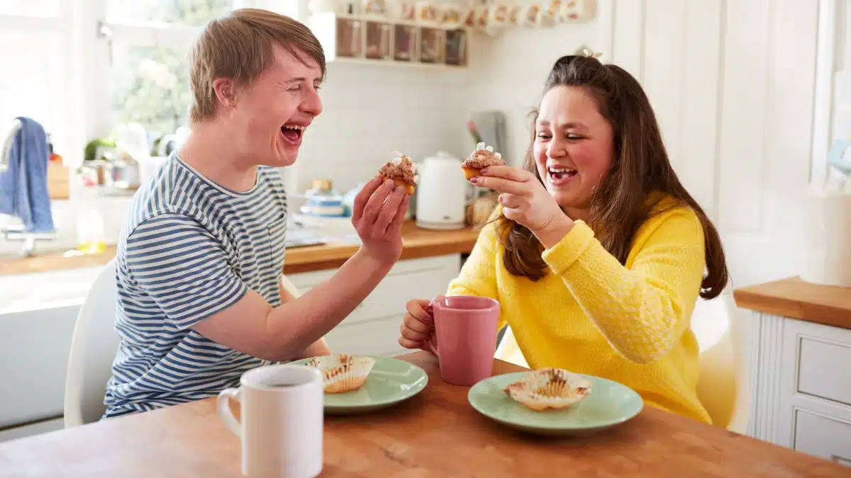 couple eating baking with coffee in the kitchen