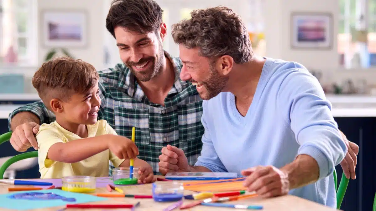 dads and son painting crafts together