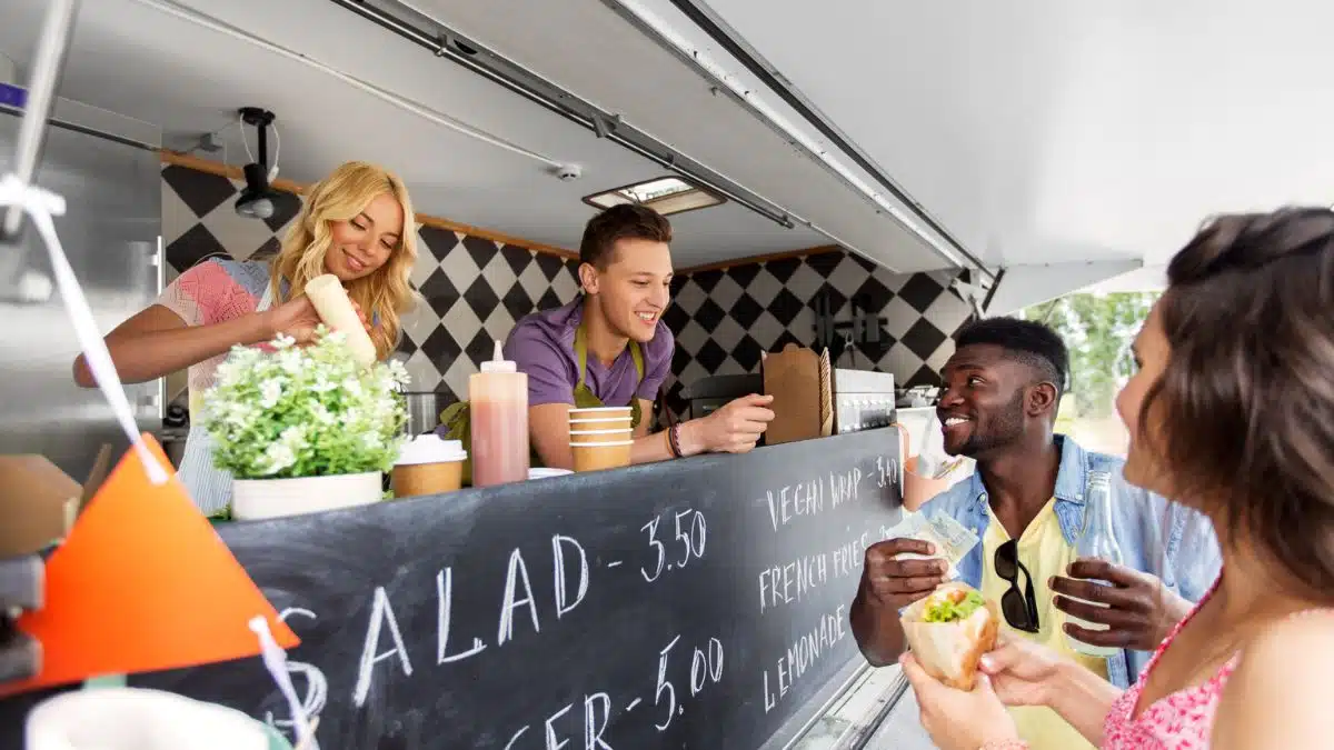 food truck cooks selling to customers