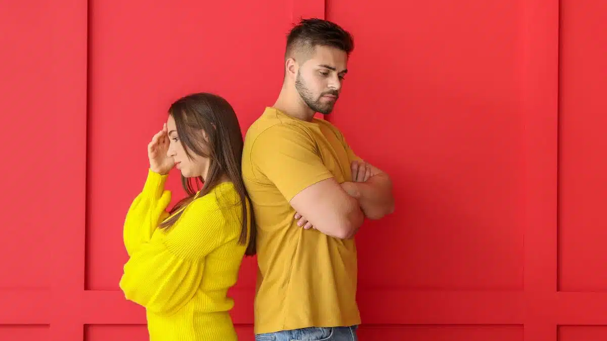 angry couple with a red background