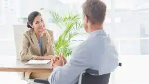 Businesswoman interviewing candidate in office
