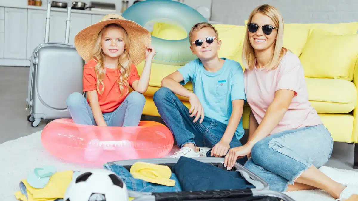 family packing for vacation with an open suitcase