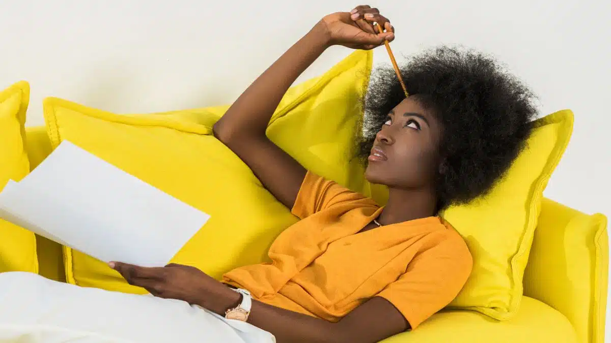 thinking woman laying on couch