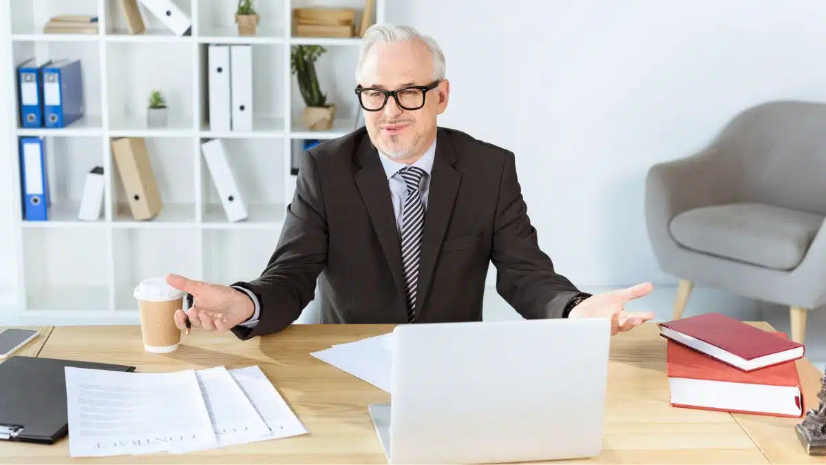 businessman at his desk with paperwork