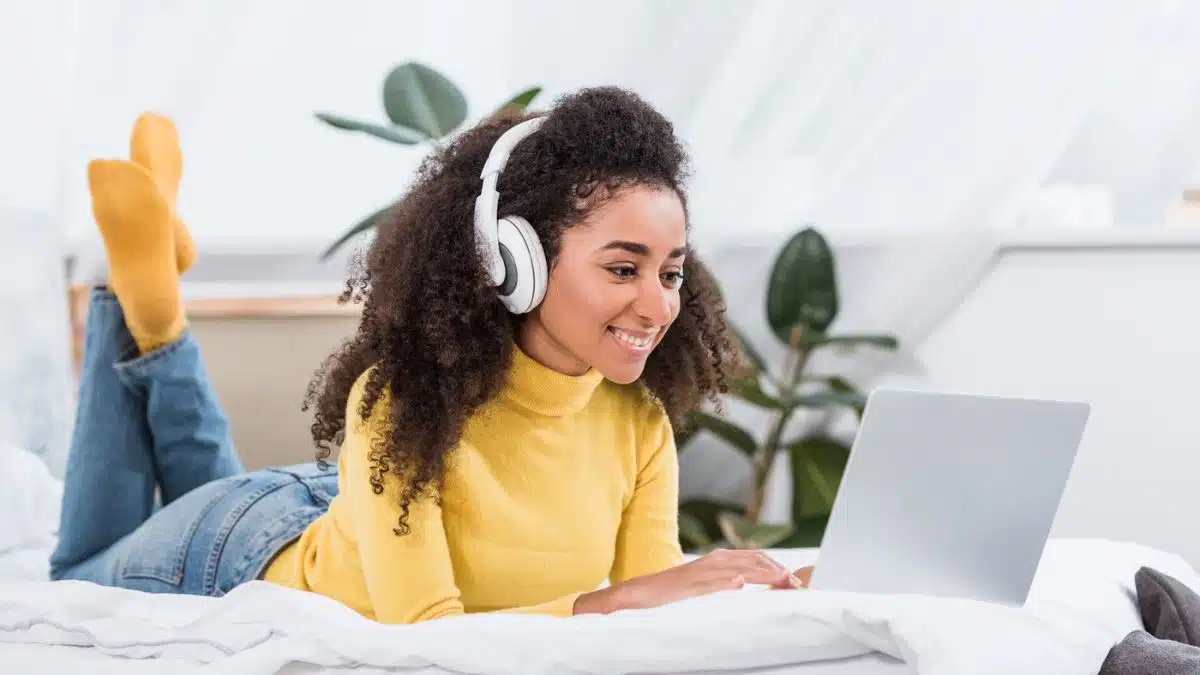 young woman with headphone and laptop