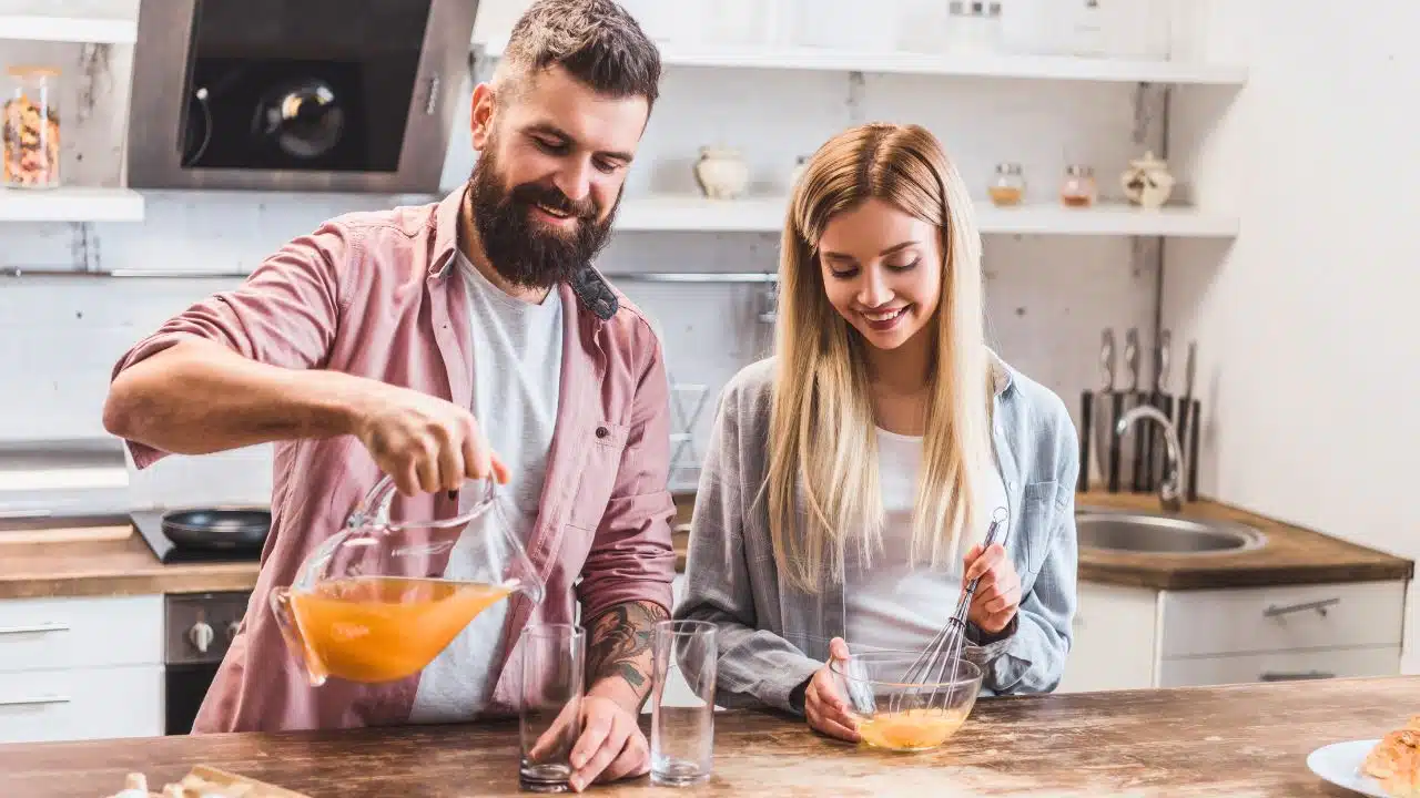 couple in the kitchen making breakfast