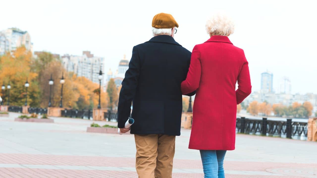 senior couple walking in the fall