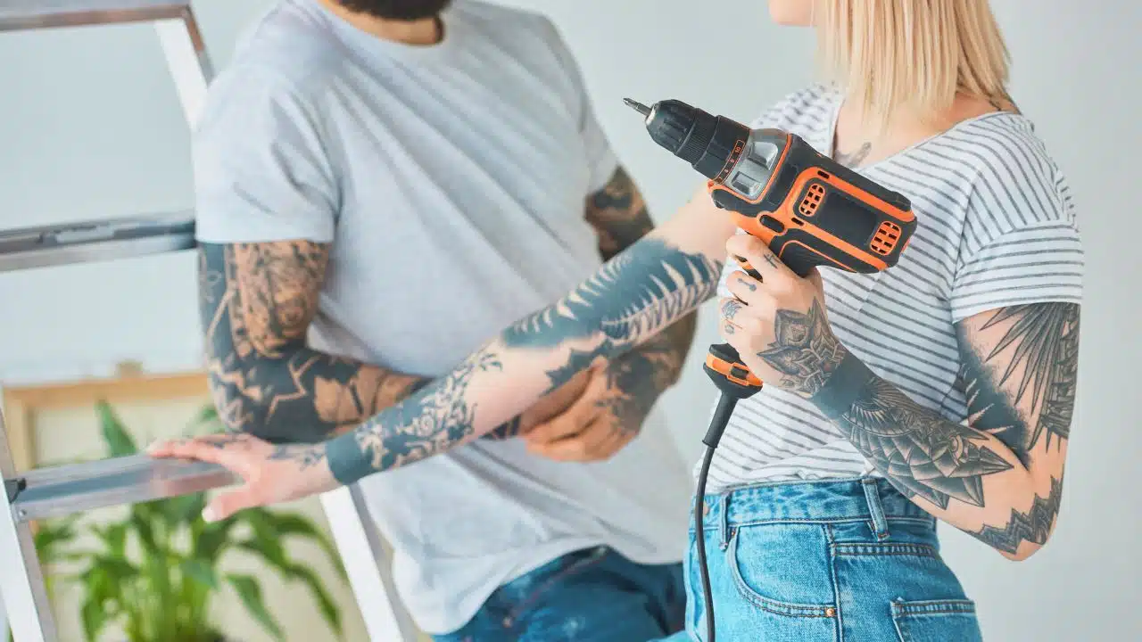 tattooed couple doing renovations