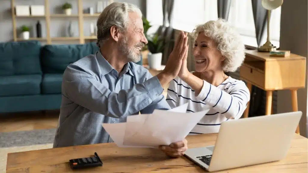 happy mature couple budgeting