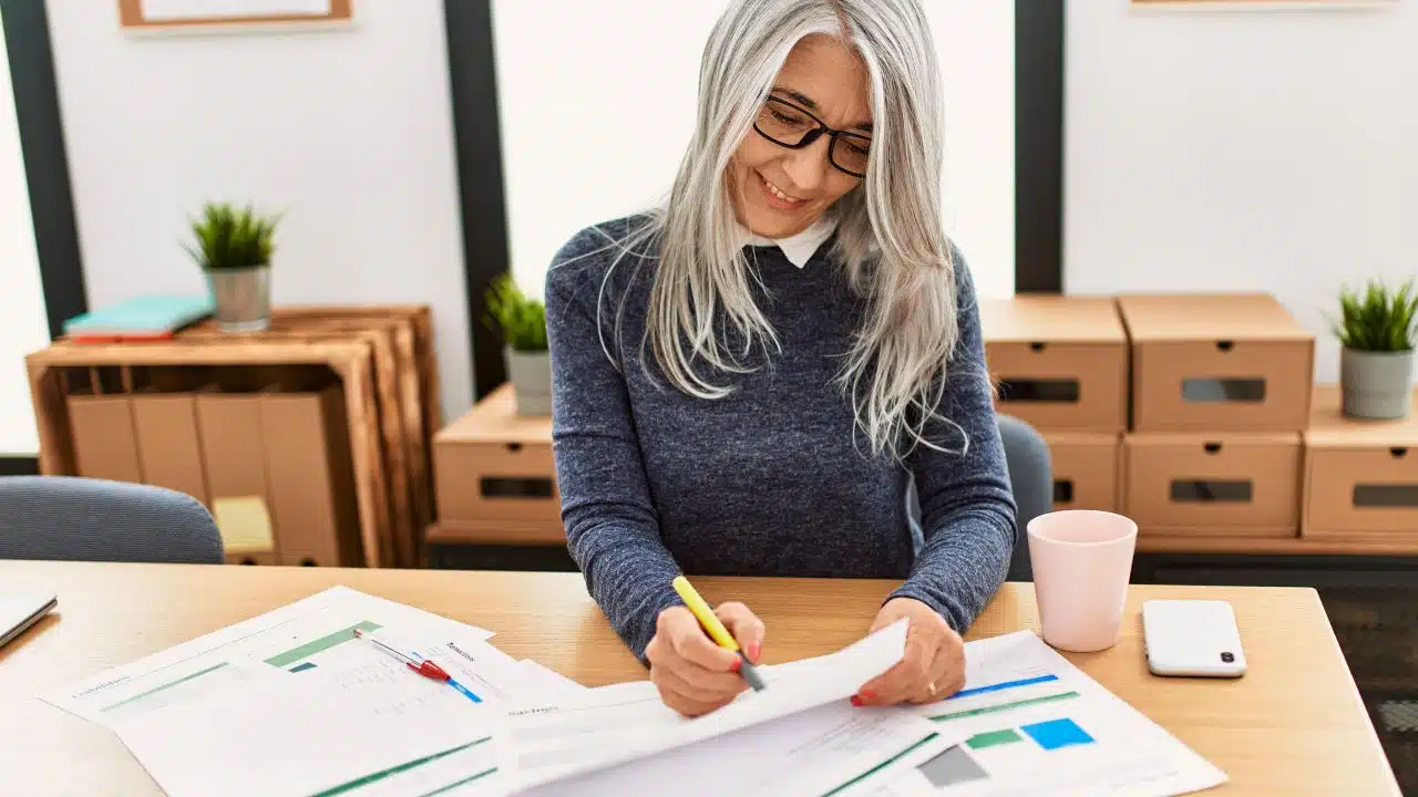 mature woman with work documents