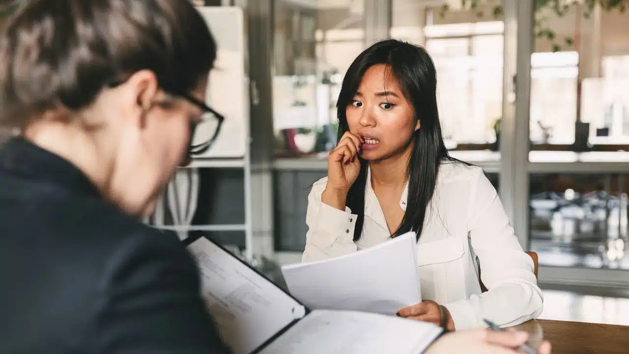 nervous young woman at work meeting