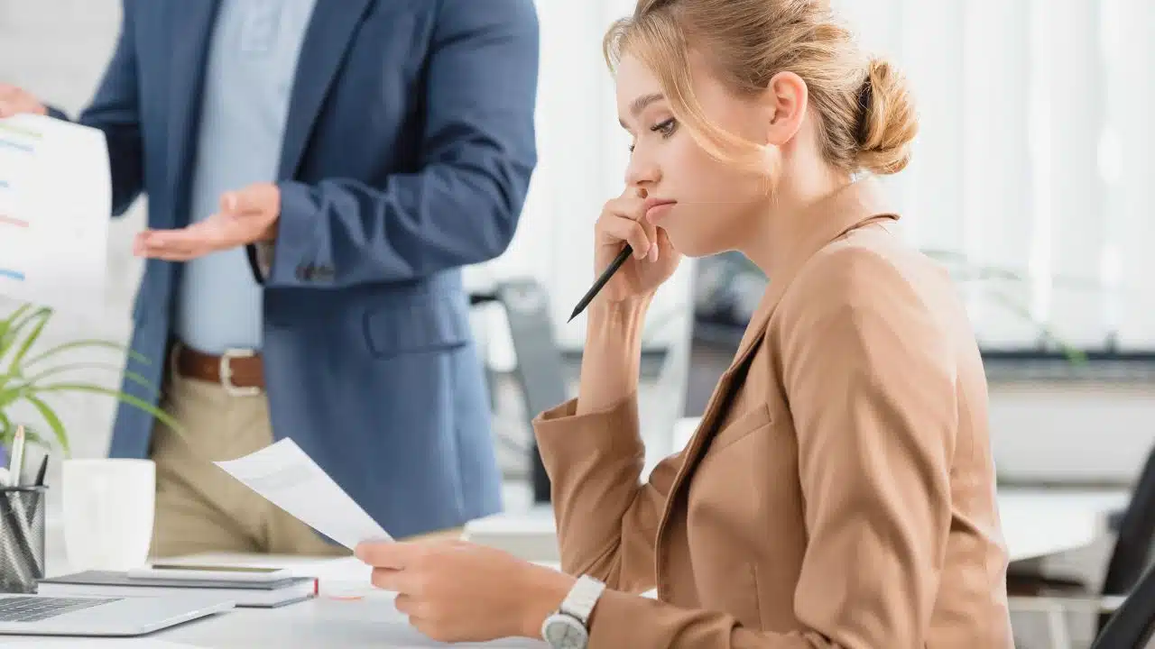 sad woman looking at work report