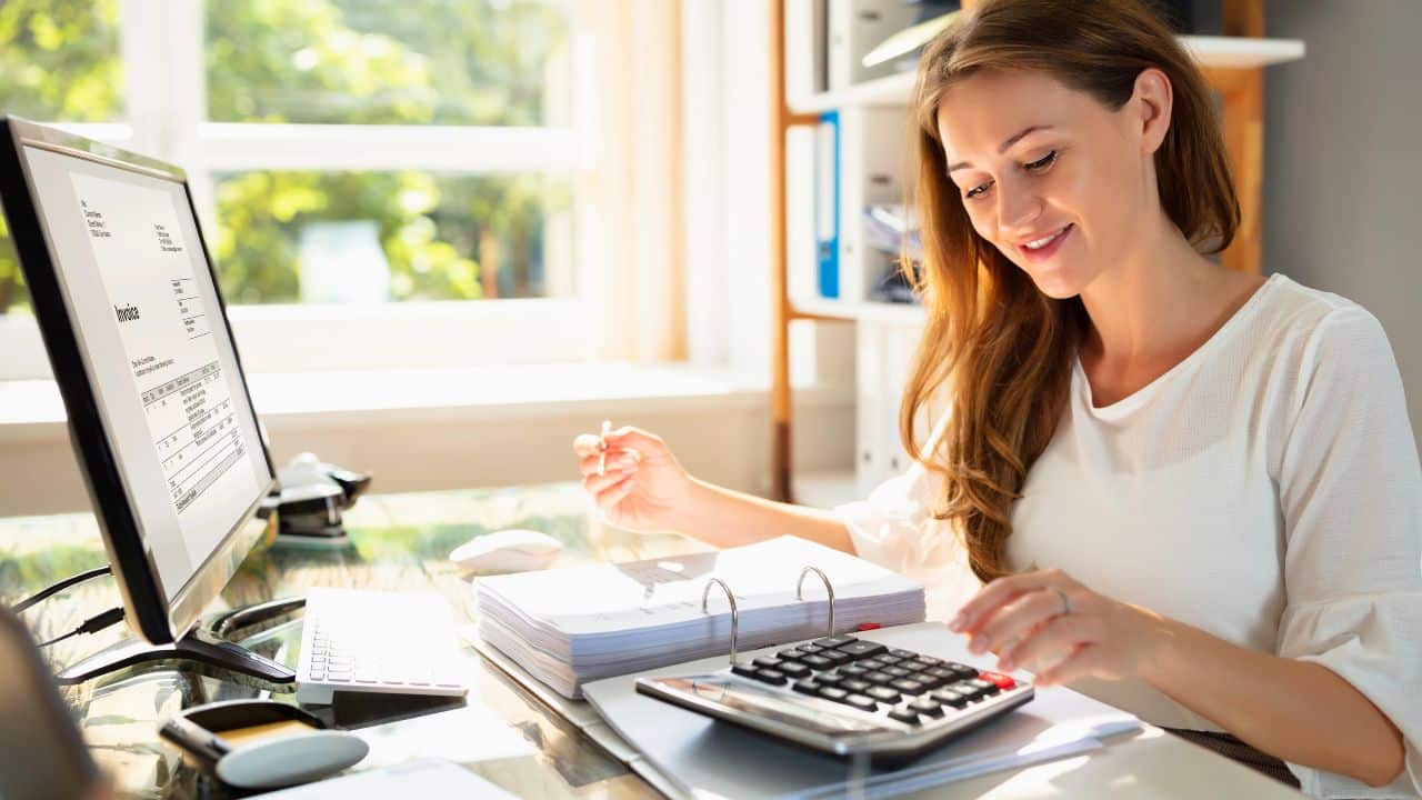 accountant calculating in her office