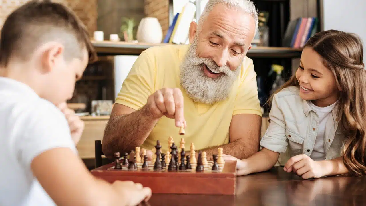 grandpa playing chess with grandkids