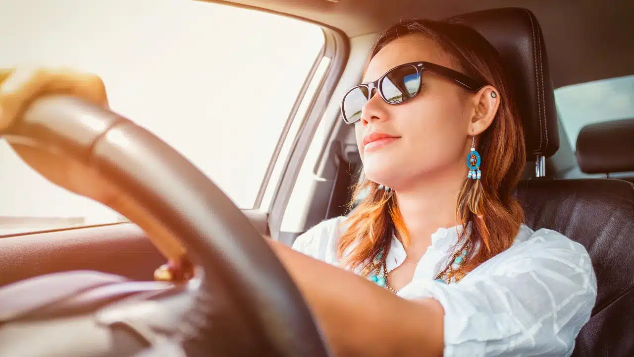 happy woman driving car