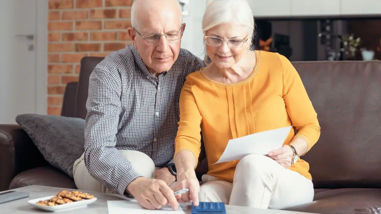 mature couple working on budget