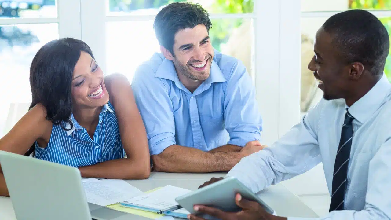 young couple meeting with financial advisor