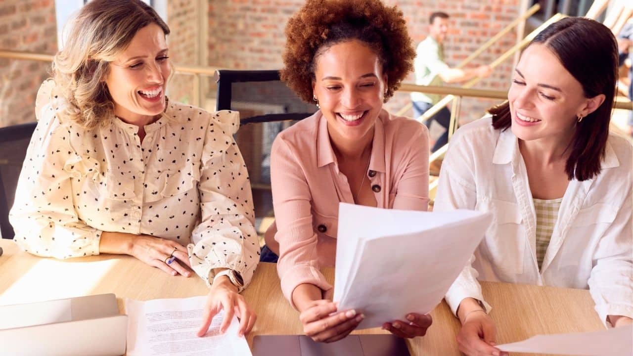 smiling coworkers working together