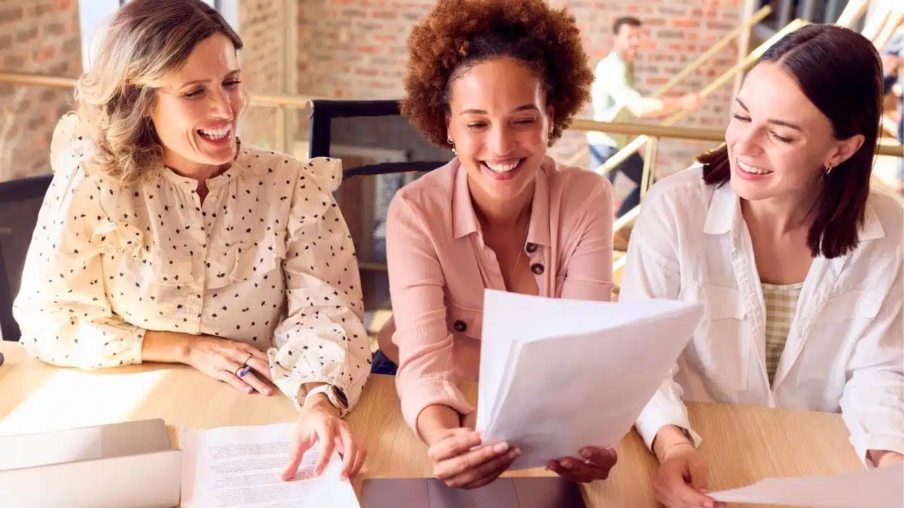 smiling coworkers working together