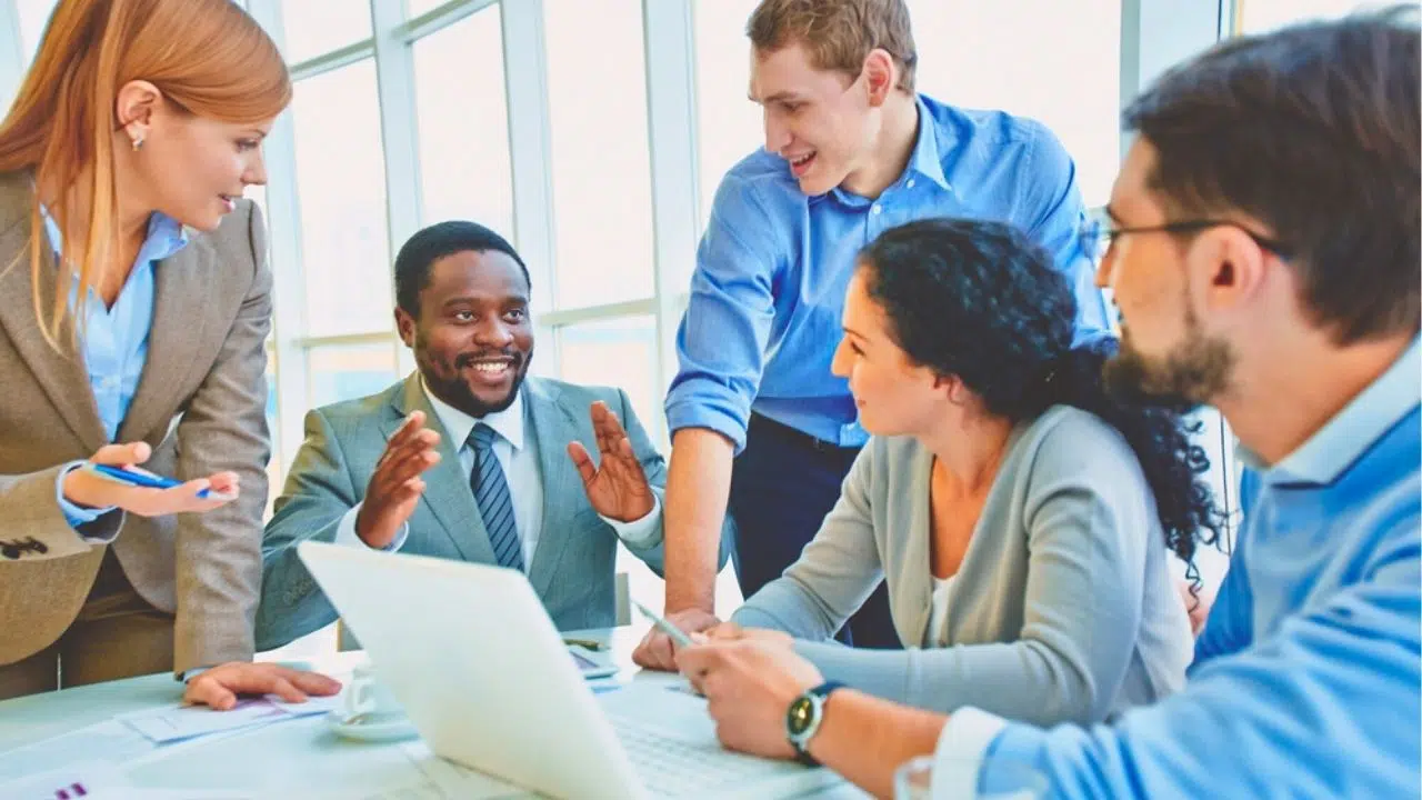 coworkers talking in a meeting