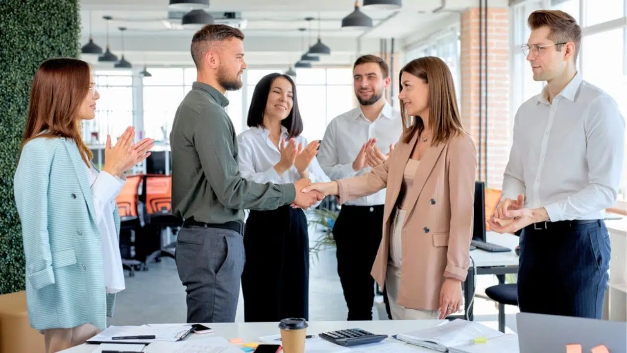 coworkers welcoming new hire