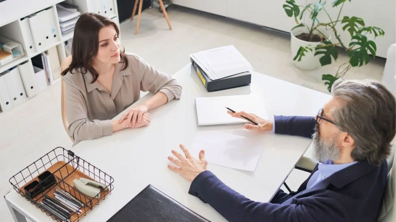 overhead view of a meeting with two staff