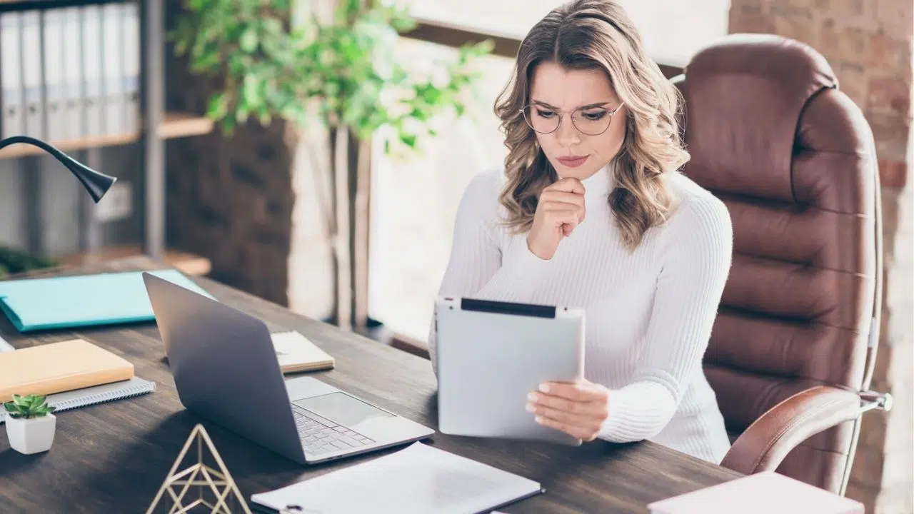 puzzled woman looking at work stuff