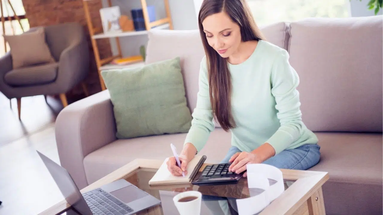 woman budgeting at coffee table