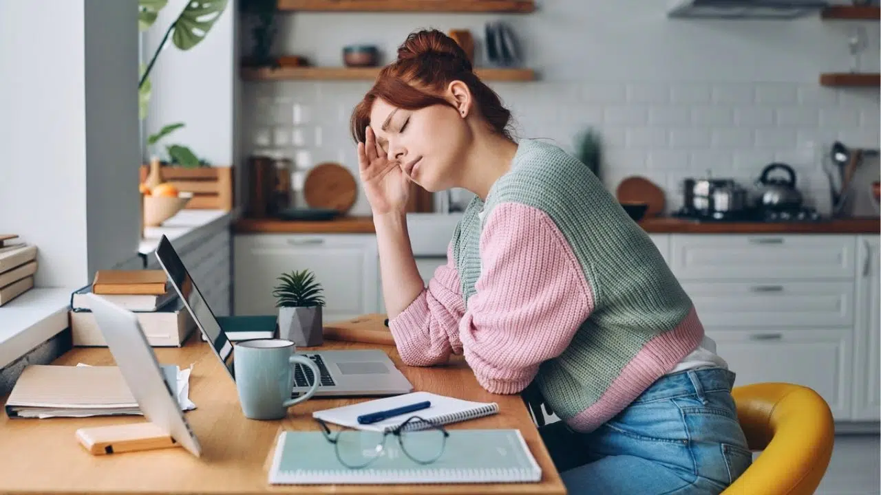 woman with headache working from home