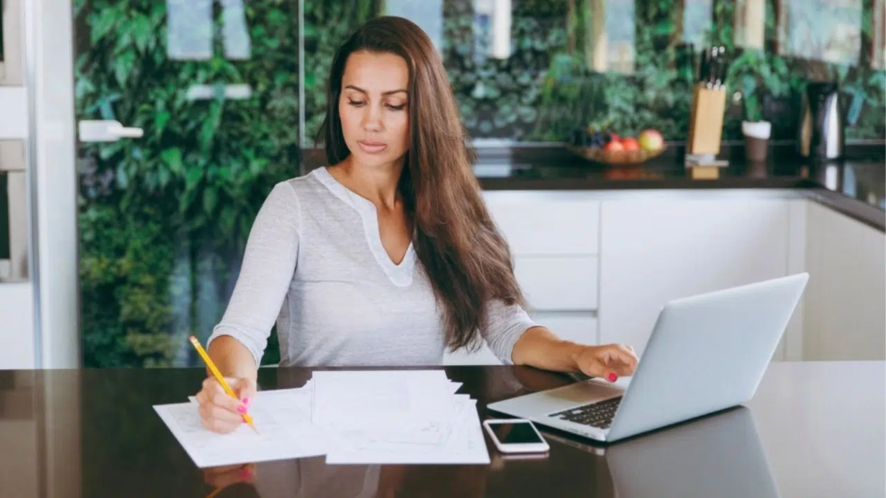 woman working at kitchen table